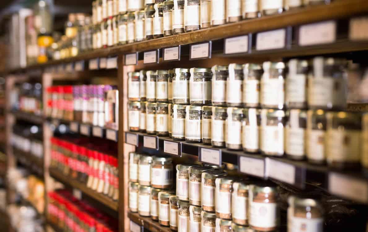 Shopping in Downtown Healdsburg, Large assortment of natural seasonings and spices in glass jars on store counter